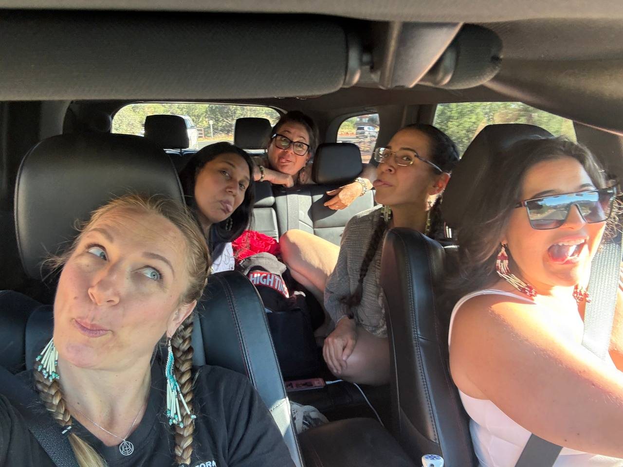Women laughing together on the drive in